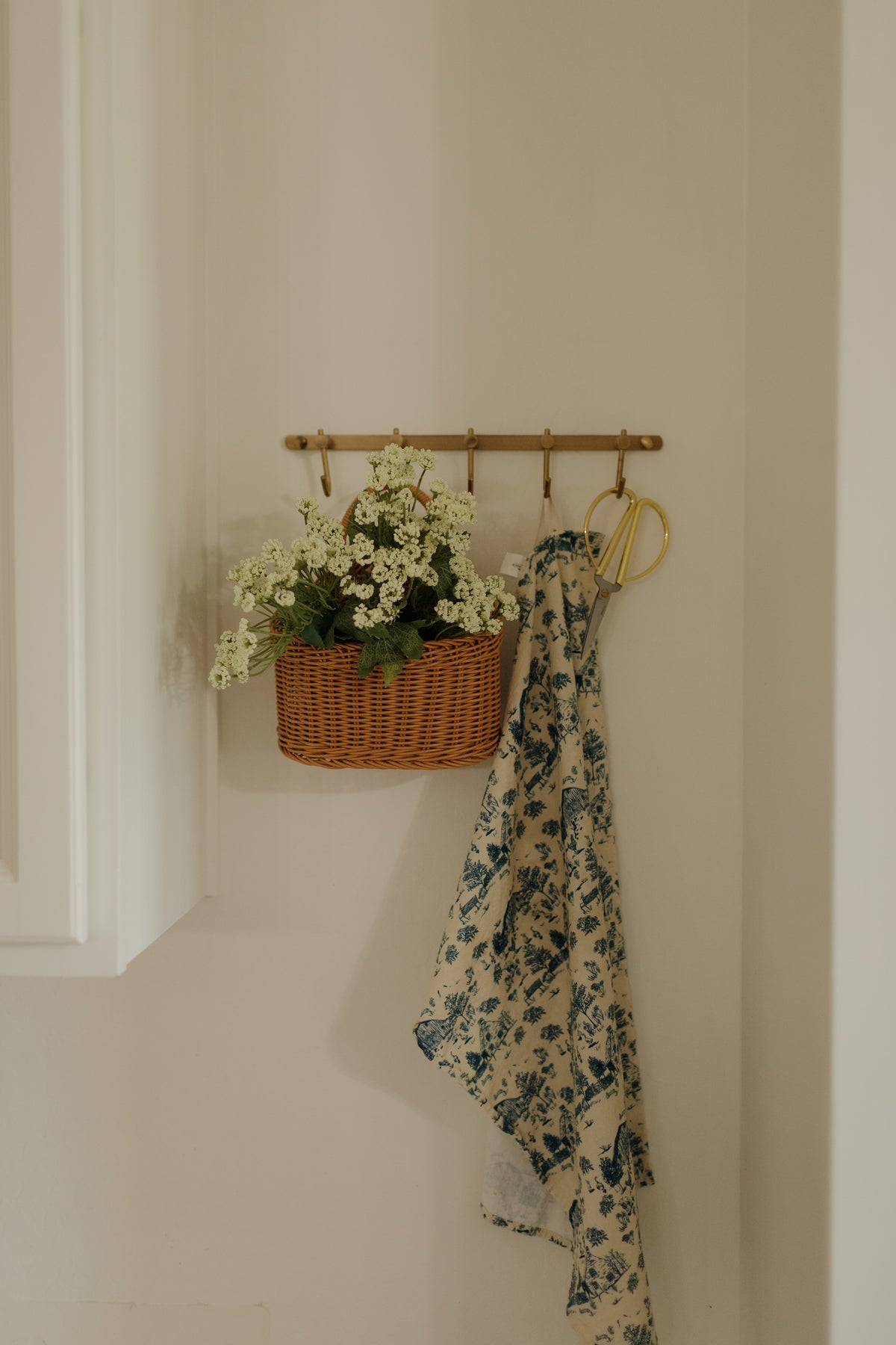 A hanging basket and apron in the farmhouse kitchen