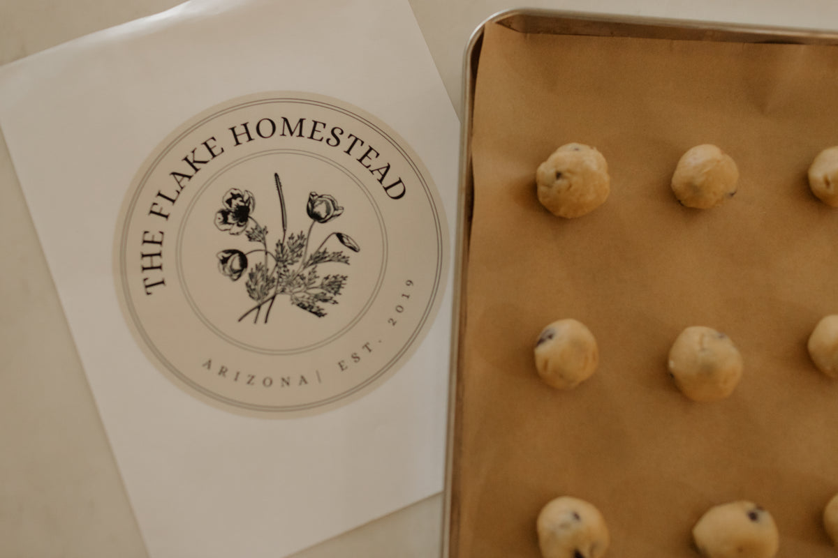 A Flake Homestead card beside a tray of fresh-baked cookies
