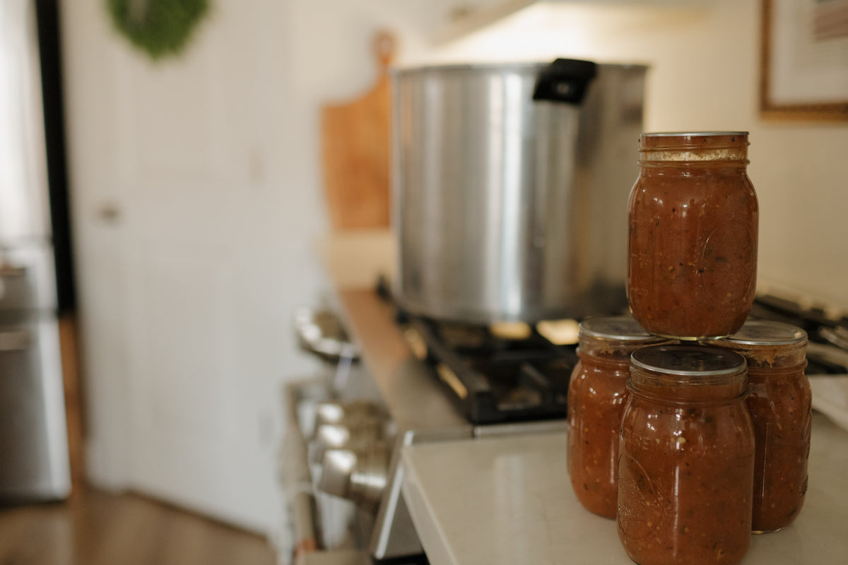Home-canned jars cooling by the stove in Abbie's kitchen
